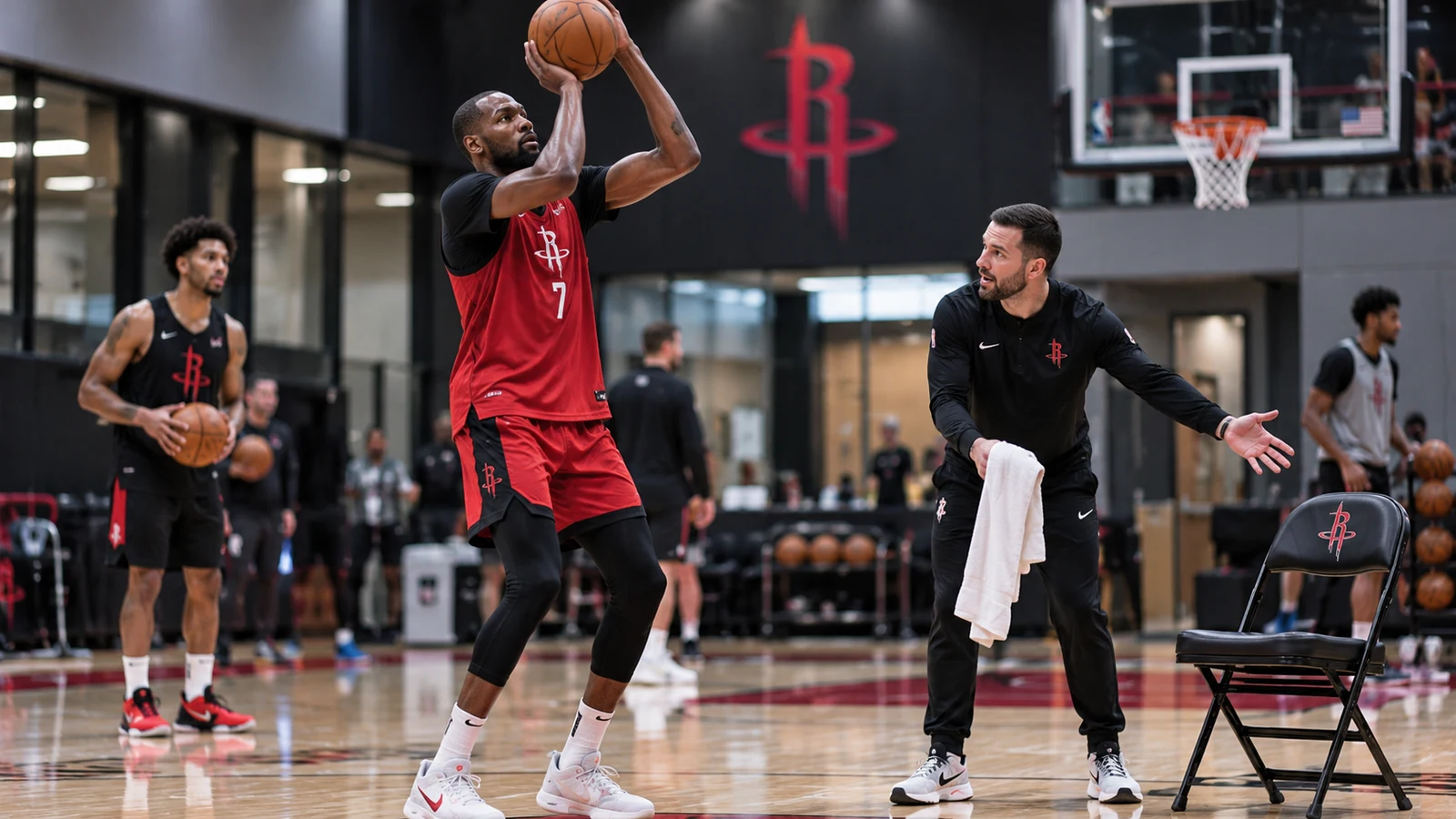 Kevin Durant in current Houston Rockets No. 7 practice gear shooting while a coach gestures toward an empty chair.