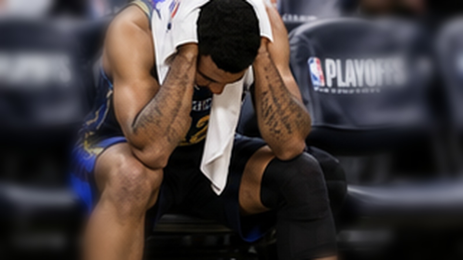 Frustrated basketball player sitting on the bench after a lead slips away.